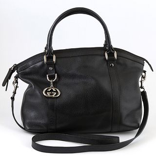 Gucci Black Grained Leather Interlocking Charm Convertible Tote, the exterior with gun metal hardware and charm, two leather handles and an adjustable
