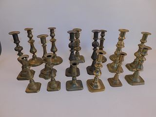 17 ANTIQUE BRASS CANDLE HOLDERS