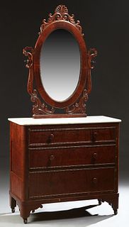 American Victorian Carved Mahogany Marble Top Dresser, 19th c., the pierced anthemion and scrolled leaf crest over an oval mirror, on C-scrolled and r