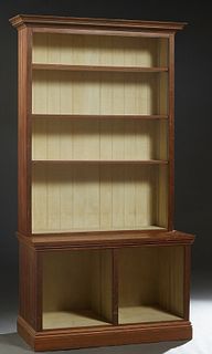 Louisiana Carved Cypress Bookcase, 20th c., the stepped crown over open shelves with beaded board sides, on a like base, on a stepped plinth, H.- 95 i
