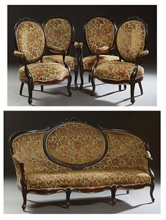 French Louis XV Style Carved Beech Parlor Suite, early 20th c., consisting of four fauteuils and a settee with a floral carved crest rail above an ova