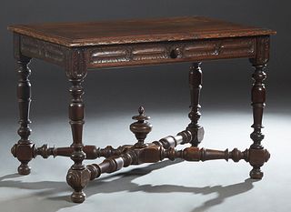 French Provincial Henri II Carved Beech Writing Table, c. 1880, the stepped carved edge top over a long feather carved frieze drawer, and a like carve