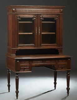 Unusual French Henri II Style Carved Oak Secretary Bookcase, 19th c., the ogee edge crown over double glazed cupboard doors flanked by reeded pilaster