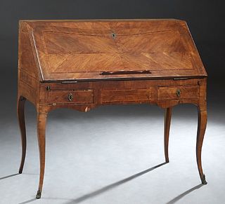 French Louis XV Style Carved Inlaid Walnut Secretary, c. 1900, the rectangular top over a concave edge slant lid with an inset leather writing surface