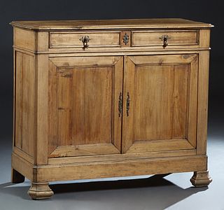 French Provincial Louis Philippe Carved Poplar Sideboard, 19th c., the rounded edge canted corner top over two frieze drawers above double cupboard do