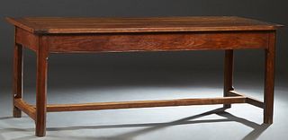 Exceptional French Provincial Carved Elm Farmhouse Table, 19th c., the rectangular top over a wide skirt, on chamfered legs joined by an H.-form stret