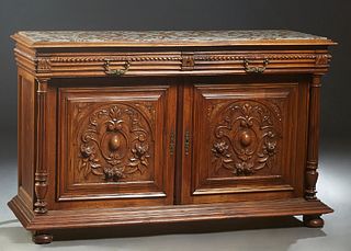 French Henri II Style Carved Walnut Marble Top Sideboard, c. 1880, the highly figured inset brown and white marble over two frieze drawers and setback