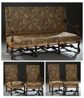French Louis XIII Style Carved Oak Five Piece Parlor Suite, early 20th c., consisting of two fauteuils, two side chairs and a settee, with canted rect