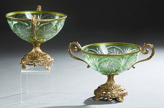 Pair of Bronze Mounted Green Cut-to-Clear Glass Center Bowls, 20th c., on reeded socle supports, to a pierced base on four splayed leaf form feet, H.-