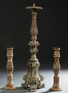 Group of Three Italian Polychromed Carved Wood Knopped Pricket Candlesticks, 19th c., consisting of a pair on stepped circular bases, together with a 