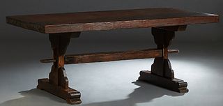 French Provincial Carved Oak Monastery Table, 19th c., the thick top on trestle supports joined by a long square stretcher, H.- 29 in., W.- 76 1/4 in.