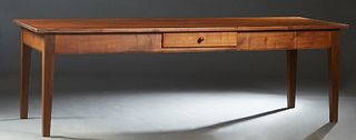 French Provincial Carved Cherry and Walnut Farmhouse Table, 19th c., the rectangular top over a wide skirt with one frieze drawer on a long side, on t
