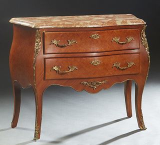 Louis XV Style Carved Mahogany Marble Top Bombe Commode, 20th c, the stepped rounded edge highly figured pink marble over two bowfront drawers, flanke