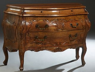 French Louis XV Style Carved Walnut Bombe Commode, 20th c., the bowed top above two serpentine frieze drawers, over two deep drawers, flanked by bombe