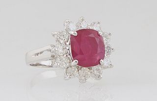 Lady's 14K White Gold Dinner Ring, with a 2.89 ct. cushion cut ruby atop a border of round diamond "points," total diamond wt.- .96 cts., Size 5 1/4, 