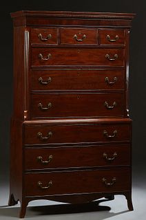 English Georgian Style Carved Mahogany Chest-on-Chest, 19th c., the stepped dentillated crown over an upper section with three frieze drawers over thr