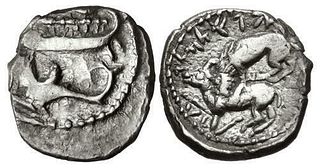 PHOENICIA, Byblos (Gebal). 'Aynel (Enylos). Coin. Circa 350-316/5 BC. AR Sixteenth Shekel (9.5mm, 0.80 g, 12h). Two hoplites, holding shields, on gall
