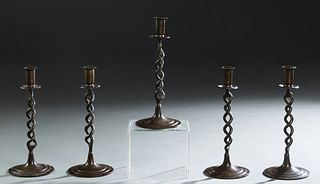 Group of Five English Brass Candlesticks, 20th c., with an open twisted support, on a stepped circular base, H.- 10 in., Dia.- 4 3/8 in. (5 Pcs.)