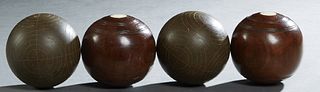 Group of Four English Wooden Bocce Balls, early 20th c., two of rosewood with two inset circular ivory plaques; and two with incised decoration, Dia.-