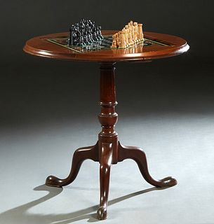 French Louis Philippe Carved Walnut Pedestal Games Table, late 19th c, the stepped circular top with an inset eglomise chess board, together with a se
