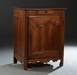 French Provincial Carved Walnut Louis XV Style Confiturier, 19th c., the stepped rounded edge and corner top over a center frieze drawer above an arch