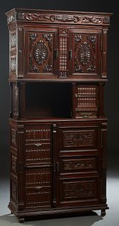 Unusual French Henri II Style Carved Walnut Sideboard, c. 1880, the stepped crown over double doors with applied carving and interior shelves, above o