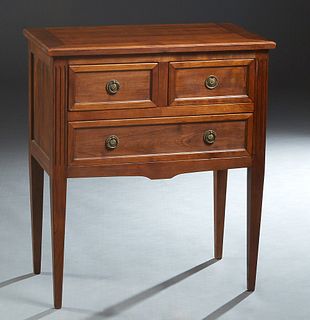 French Louis XVI Style Carved Cherry Commode, 20th c, the ogee edge top over two frieze drawers and a long bottom drawer, flanked by reeded pilasters,