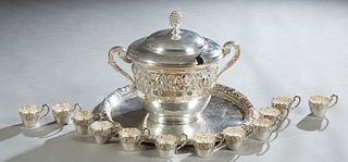 Large Silverplate Punch Set, 20th c., consisting of a covered punchbowl, 12 punch cups and a circular tray, all with repousse floral decoration, the b