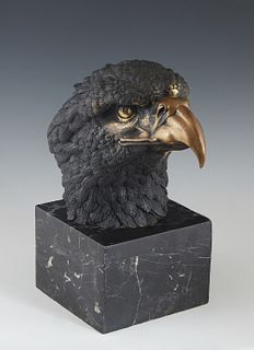 Gilt and Patinated Bronze Eagle Head, 20th c., on a large square figured black marble plinth, H.- 11 in., W.- 5 1/2 in., D.- 9 3/4 in.