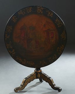 English Carved Mahogany Circular Tilt Top Table, late 19th c., with Chinoiserie decoration, on a turned ebonized gilt decorated support, to tripodal g