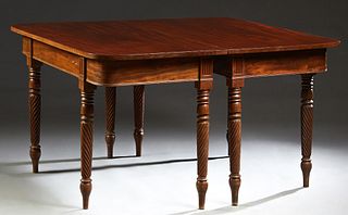 American Carved Mahogany D- End Dining Table, 19th c., the rounded edge top over a wide skirt, on turned and twist carved legs with toupie feet, with 