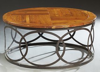 Provincial Style Pine and Iron Circular Coffee Table, 21st c., on an iron base with pierced scrolled sides, H.- 17 3/4 in., W.- 39 1/2 in.