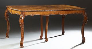 American English Syle Carved Burled Walnut Dining Table, 20th c., the carved edge bowed end top over a serpentine carved skirt, on well carved cabriol