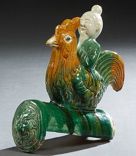 Chinese Glazed Earthenware End Ridge Roof Tile, 20th c., of a sage riding a rooster, H.- 12 3/4 in., W.- 4 in., D.- 11 in.