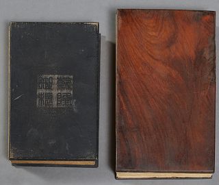 Two Chinese Books, consisting of a mahogany bound book, 20th c., the pages folding out to form a panoramic printed landscape; together with a 19th c. 