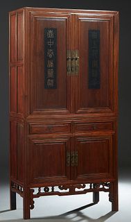 Large Chinese Carved Elm Cabinet, late Qing dynasty, Jiangsu province, with double doors over two frieze drawers, above lower double doors, on reeded 