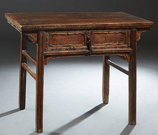 Chinese Ming Style Carved Elm Writing Table, 19th c., the rectangular top over a long frieze drawer with an iron pull, on block legs joined by rectang
