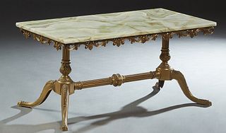 French Louis XV Style Onyx Top Brass Coffee Table, 20th c., the rectangular highly figured green onyx top over a pierced scalloped brass skirt, on dou