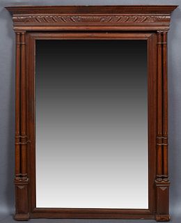 French Henri II Style Carved Oak Overmantel Mirror, c. 1880, the stepped crown over a setback wide beveled rectangular plate, flanked by four turned r