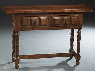 French Provincial Renaissance Style Carved Beech Console Table, 20th c., the thick plank top over two frieze drawers, on turned legs joined by an H-fo