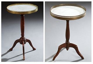 Two French Louis XVI Style Carved Mahogany Marble Top Lamp Tables, 20th c., the first with a brass gallery over a figured circular white marble, on a 