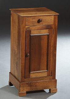 French Provincial Louis Philippe Carved Walnut Nightstand, 19th c, the rectangular top over a frieze drawer and a long cupboard door, on a plinth base