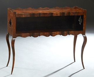 Unusual Louis XV Style Walnut Console Table, 20th c., the scalloped gallery top over sides with cross shaped cutouts, to a lower shelf with a serpenti