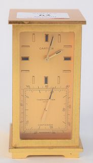 Cartier Brass Partners Desk Clock, having a thermometer and hygrometer, height 4 inches, width 2 1/4 inches, depth 2 1/4 inches.