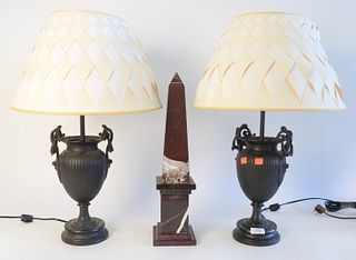 Three Piece Group, to include a pair of bronze urns with wreath handles, made into table lamps, height 12 1/2 inches; along with a rouge marble obelis