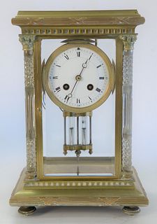 Regulator Clock, brass, glass, and crystal, having cut crystal columns, height 12 1/2 inches.