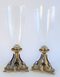 Pair of Brass Candlesticks, having glass hurricane shades on silvered swan supports, on triangular base and shell pad feet, 19th Century, height 16 1/