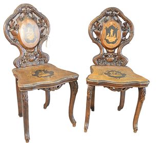 Pair Black Forest Side Chairs, with open, carved backs, and inlaid back and seats, height 38 inches.