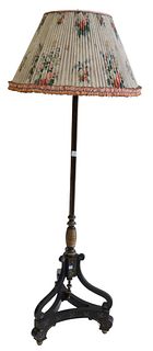 Contemporary Black stenciled Floor lamp with tripod base, height 64 inches.