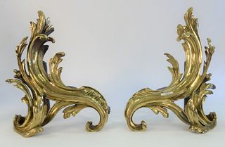 Pair of Louis XV Style Bronze Chenets, modeled as stylized acanthus leaf, marked Made in Germany, height 15 inches.